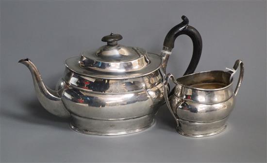 A silver teapot and matching sucrier of oval form, Sheffield 1917, makers Harrison Bros & Howson.